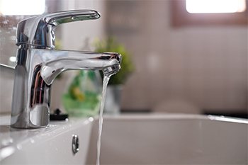 Bathroom sink faucet running water